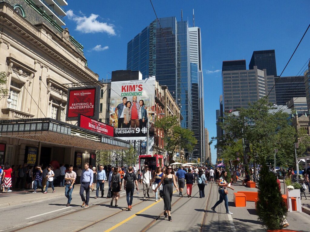 Crowds walk past the Royal Alexandra Theatre during the Toronto International Film Festival.